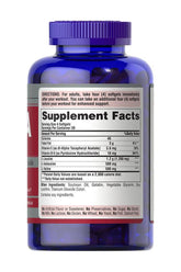 Puritan's Pride BCAA 2200 capsules supplement facts on blue bottle for muscle recovery and energy support.